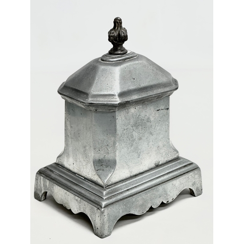 117 - A 19th Century lead tobacco jar/tea caddy. 12.5x9.5x18cm.