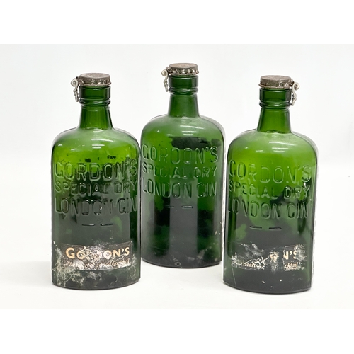 512 - Three 1920’s Gordon’s Special Dry London Gin bottles. 19cm