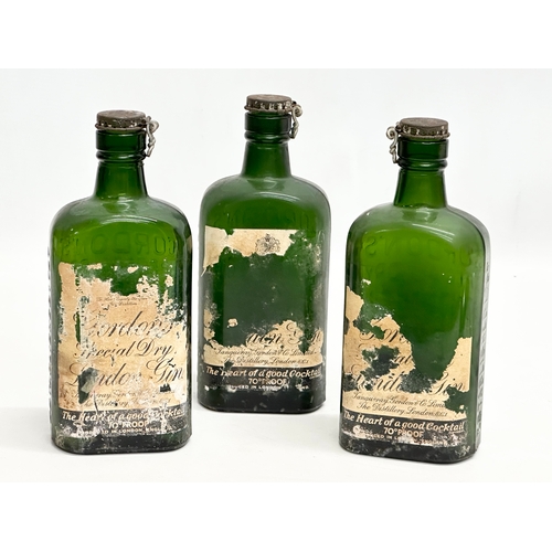 512 - Three 1920’s Gordon’s Special Dry London Gin bottles. 19cm