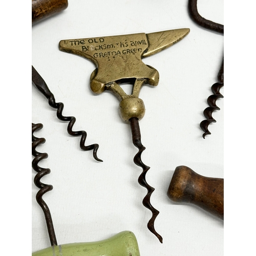 212 - A collection of 19th and Early 20th Century cork screws. Including The Old Blacksmiths Anvil Gretna ... 