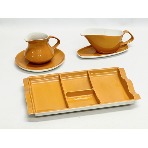 664 - Poole Pottery “Desert Song” part dinning breakfast set. A 4 section serving tray, large milk jug and... 