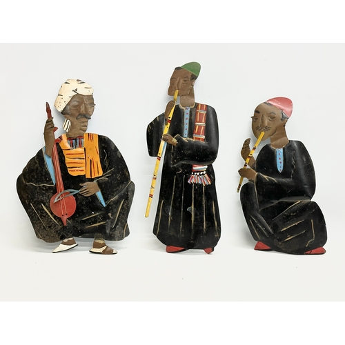 217 - A set of 5 Early/Mid 20th Century Afghan tin wall plaque musicians. 26x30cm. 38cm