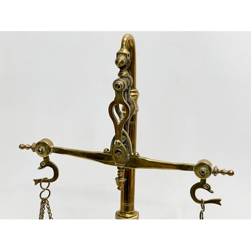 214 - Late 19th/Early 20th Century brass justice scales. 41cm