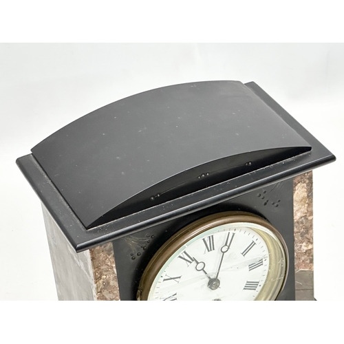 239 - A Late 19th Century Victorian slate mantle clock. With key and pendulum. 21x12x25cm.