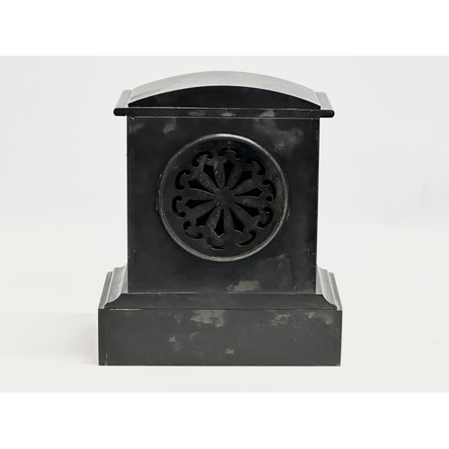 239 - A Late 19th Century Victorian slate mantle clock. With key and pendulum. 21x12x25cm.