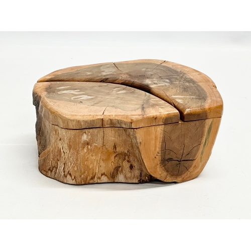 612 - A carved yew wood tree stump trinket box. 22x17x10cm