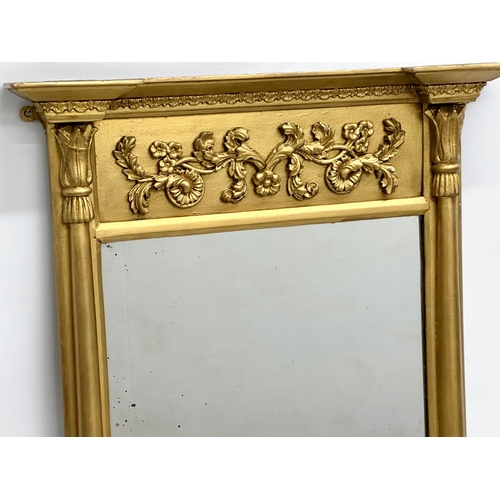 264 - An Early 19th Century Regency gilt framed pier mirror. 63x96cm