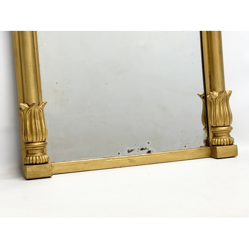 264 - An Early 19th Century Regency gilt framed pier mirror. 63x96cm