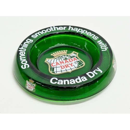 617 - A Canada Dry Bristol Green glass ashtray. 19.5cm.