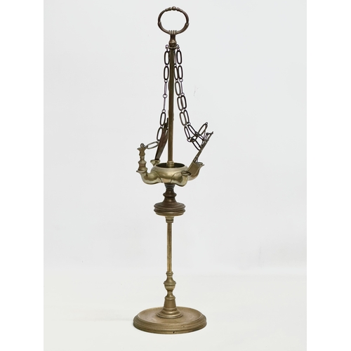 601 - A Late 19th/Early 20th Century brass Lucerna oil lamp. 59cm