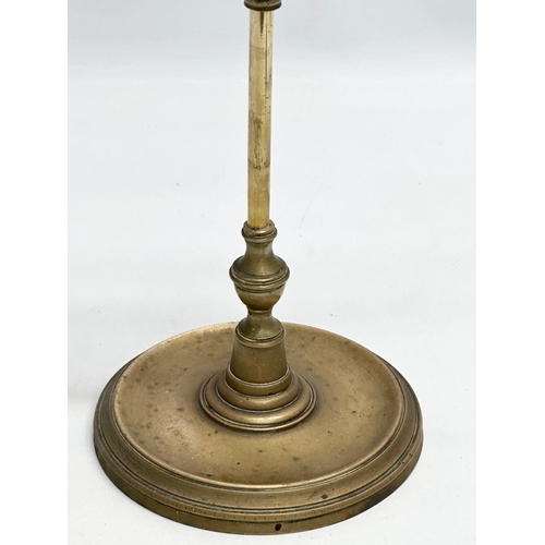 601 - A Late 19th/Early 20th Century brass Lucerna oil lamp. 59cm