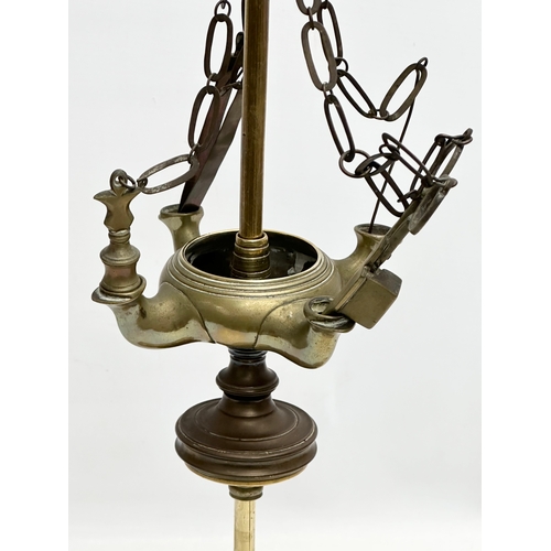 601 - A Late 19th/Early 20th Century brass Lucerna oil lamp. 59cm