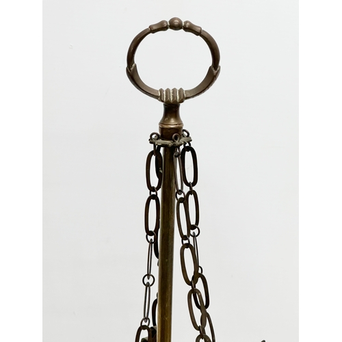 601 - A Late 19th/Early 20th Century brass Lucerna oil lamp. 59cm