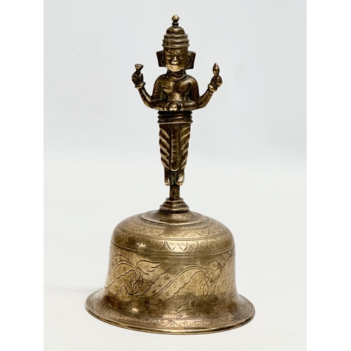 360 - A Late 19th Century Burmese style brass bell. 10x18cm.