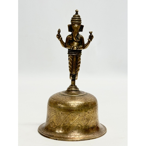 360 - A Late 19th Century Burmese style brass bell. 10x18cm.