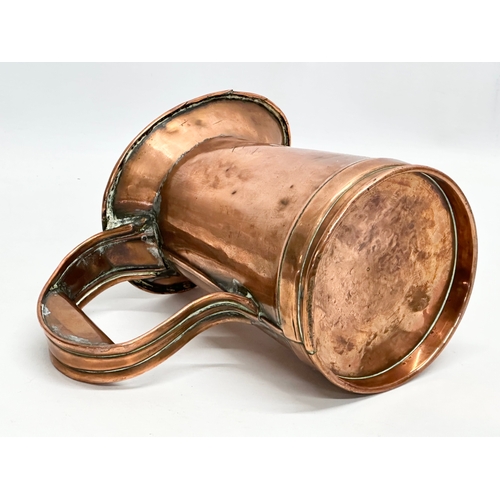 610 - A Victorian copper jug. 22x18cm