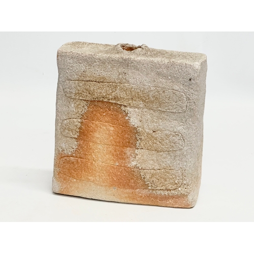 392 - A signed Mid 20th Century Japanese Shigaraki square bottle style vase. 17x5x18cm.