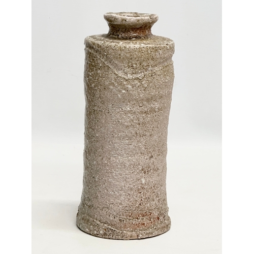 394 - A signed Mid 20th Century Japanese Shigaraki bottle style vase. 11x24cm.