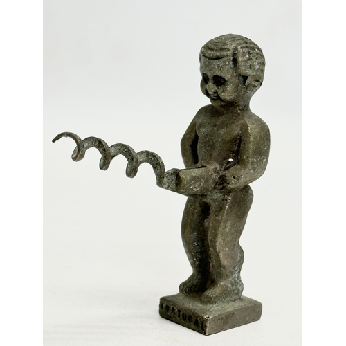 614 - A 19th Century bullhead tin opener. Together with a novelty corkscrew.