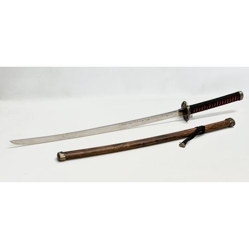 638 - A large Japanese samurai style sword. 91cm