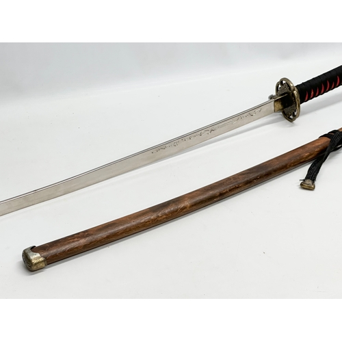 638 - A large Japanese samurai style sword. 91cm