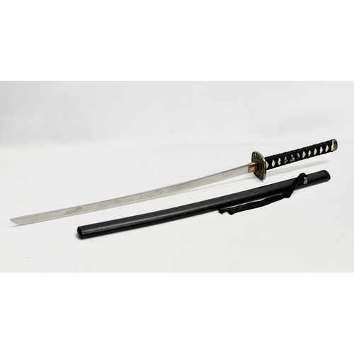 639 - A large Japanese samurai style sword. 93cm