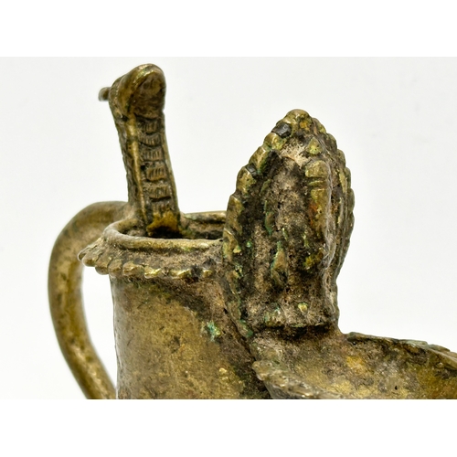 232 - A 19th Century bronze Sukunda lamp/oil lamp. 13x10cm