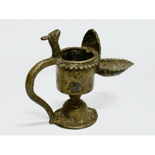 232 - A 19th Century bronze Sukunda lamp/oil lamp. 13x10cm