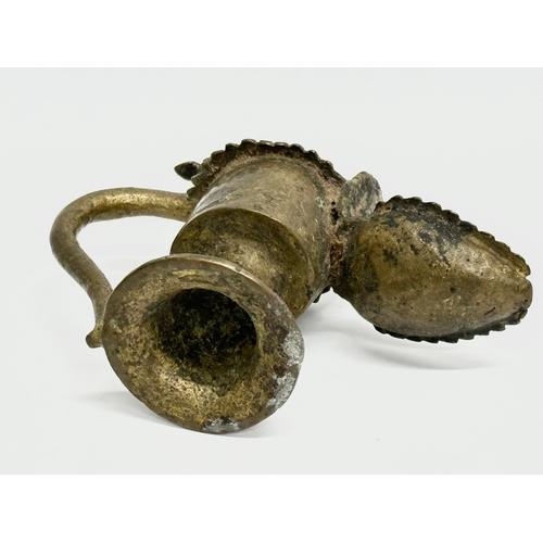 232 - A 19th Century bronze Sukunda lamp/oil lamp. 13x10cm