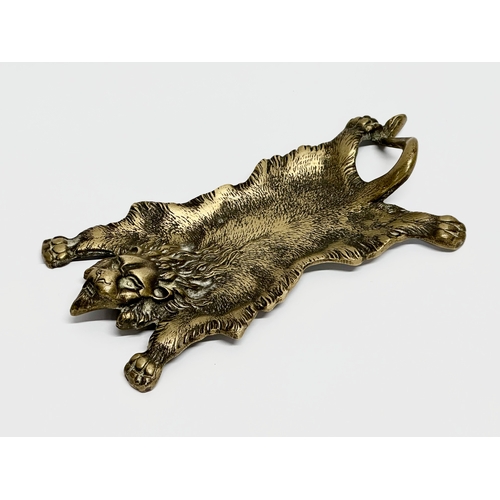 240 - A Late 19th Century brass lion rug desktop pen dish. 19cm