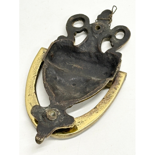 620 - Victorian brassware. A Late 19th Century brass door knocker 21cm. A small Galleon style door knocker... 