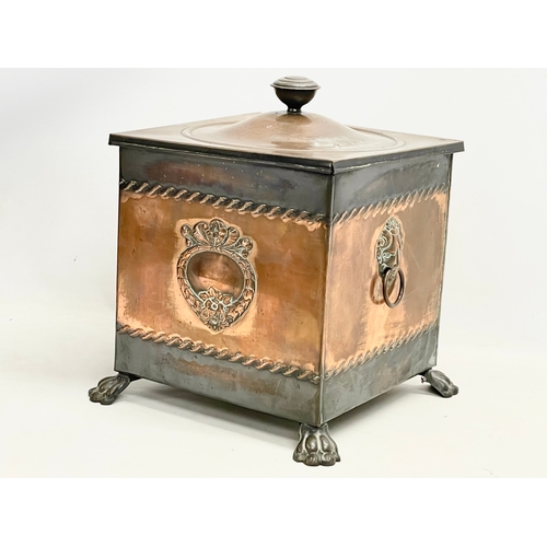 399 - A Victorian copper coal bin with liner and lion paw feet. 35x35x41cm