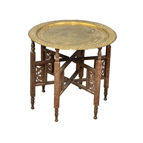 794 - A late 19th century Burmese folding table with brass top 58x53cm (6)