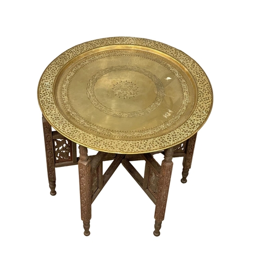 794 - A late 19th century Burmese folding table with brass top 58x53cm (6)