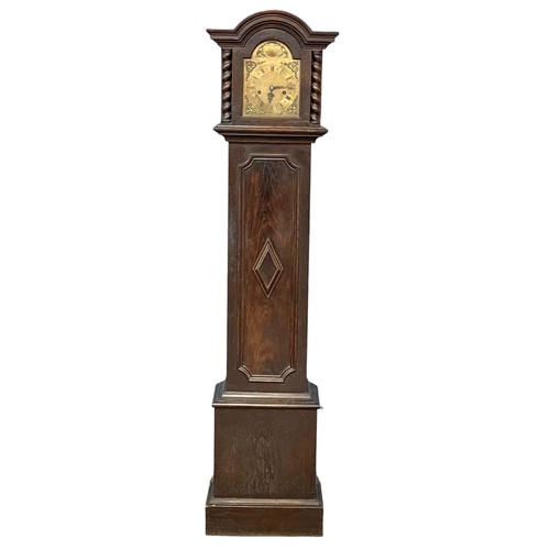 796 - An early 20th century oak long case clock with brass face by Tempus Fugit, in the Jacobean style. Wi... 