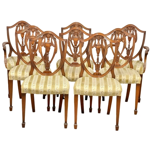 799 - A set of 8 Hepplewhite style dining chairs. (6)