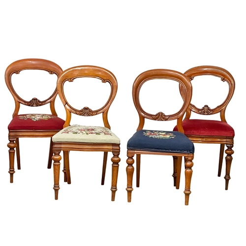 800 - A set of 4 Victorian balloon back chairs with tapestry seats.