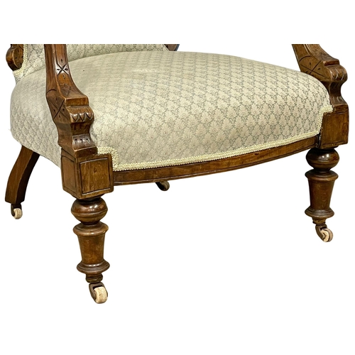 804 - A Victorian parlour open armchair. (2)