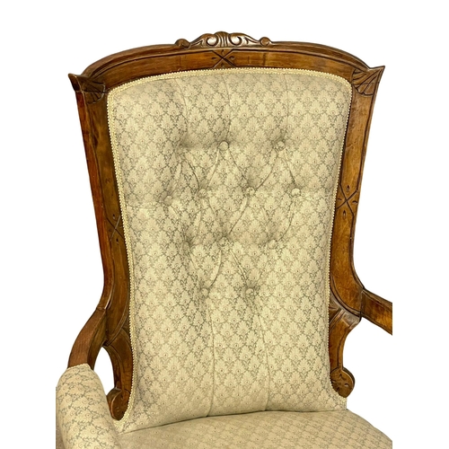 804 - A Victorian parlour open armchair. (2)