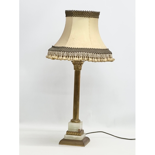 631 - A Mid 20th Century brass and onyx table lamp with Corinthian style column. 67cm