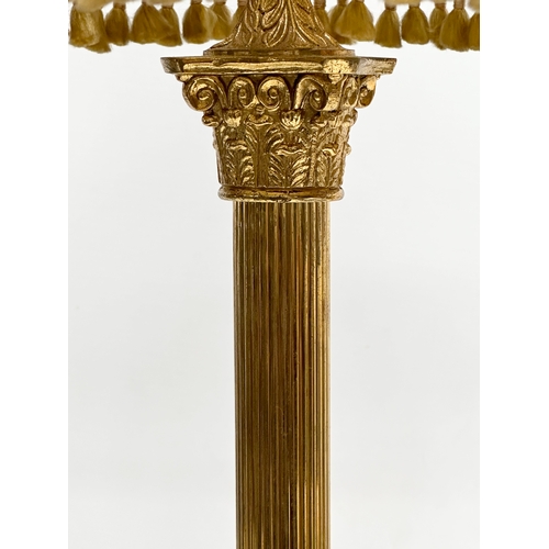 631 - A Mid 20th Century brass and onyx table lamp with Corinthian style column. 67cm