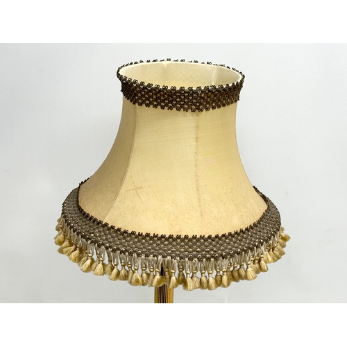 631 - A Mid 20th Century brass and onyx table lamp with Corinthian style column. 67cm