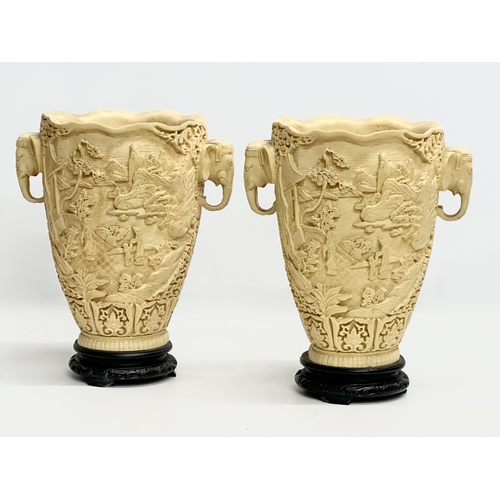 633 - A pair of large Mid/Late 20th Century Chinese carved resin vases on wooden bases. 25x19x31cm.