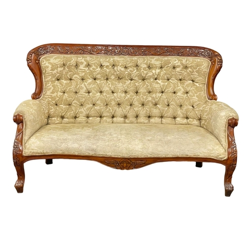 713 - A large Victorian style carved mahogany couch. 8