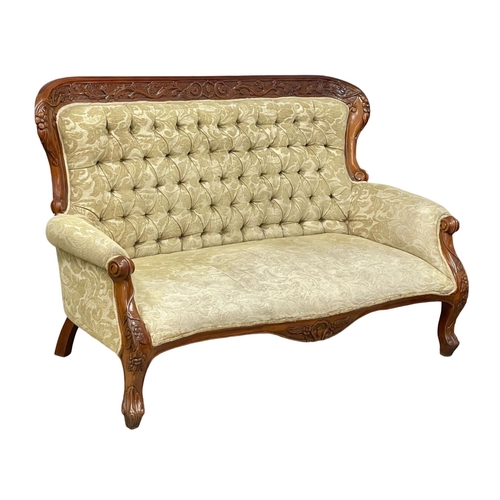 713 - A large Victorian style carved mahogany couch. 8