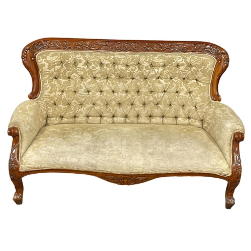 713 - A large Victorian style carved mahogany couch. 8