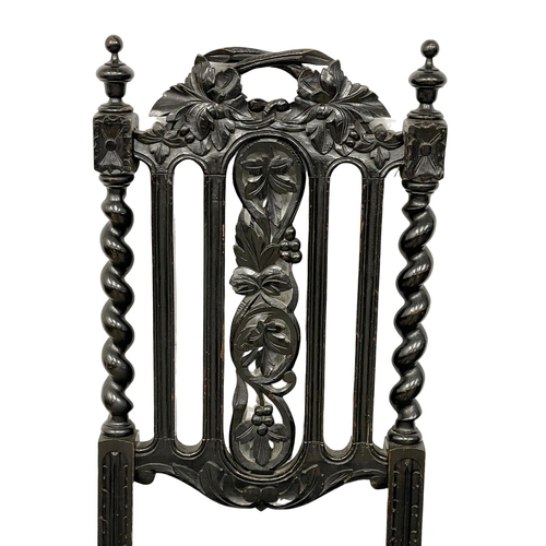 374 - A pair of late 19th century Jacobean style carved oak side chairs. 3