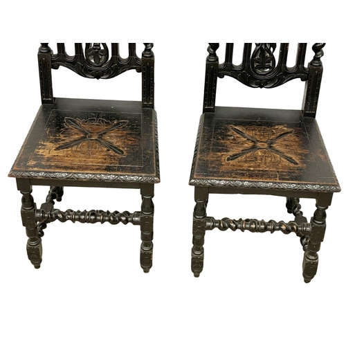 374 - A pair of late 19th century Jacobean style carved oak side chairs. 3