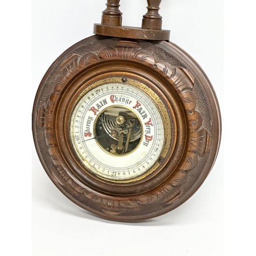 702 - A Late 19th Century Victorian wall barometer. 41cm