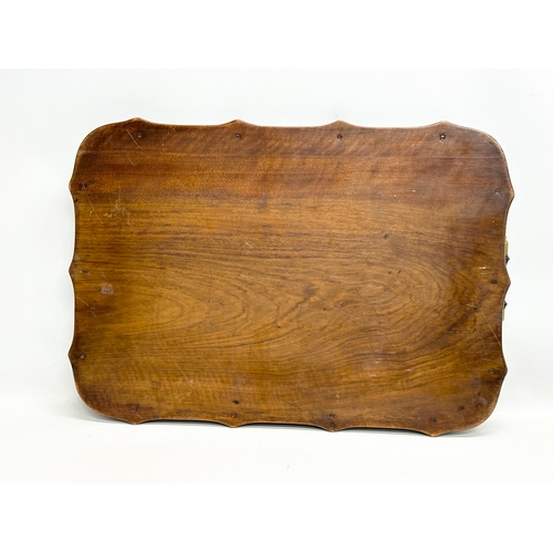 703 - An Early 20th Century serving tray. 59x41cm.